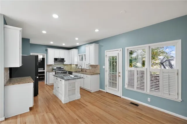 a room with furniture and a wooden floor