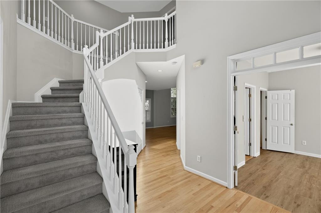 10950 Regal Forest Drive Suwanee, GA 30024 - Photo 25 of 52 a view of entryway and hall with wooden floor