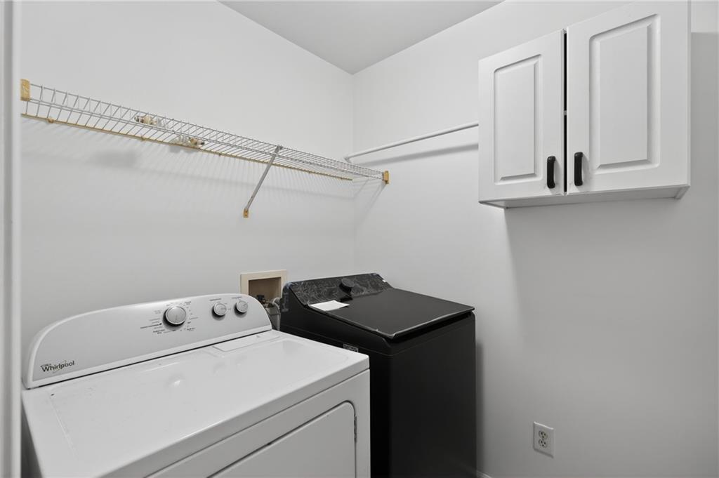 10950 Regal Forest Drive Suwanee, GA 30024 - Photo 27 of 52 a utility room with dryer and washer