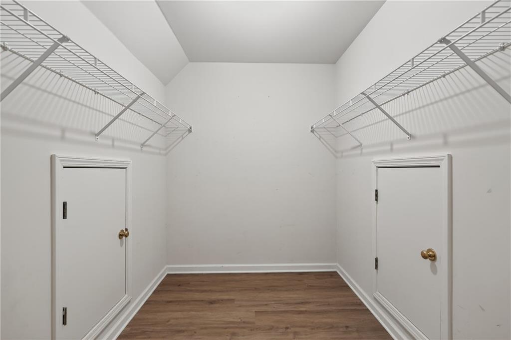 10950 Regal Forest Drive Suwanee, GA 30024 - Photo 28 of 52 a view of a storage & utility room with wooden floor