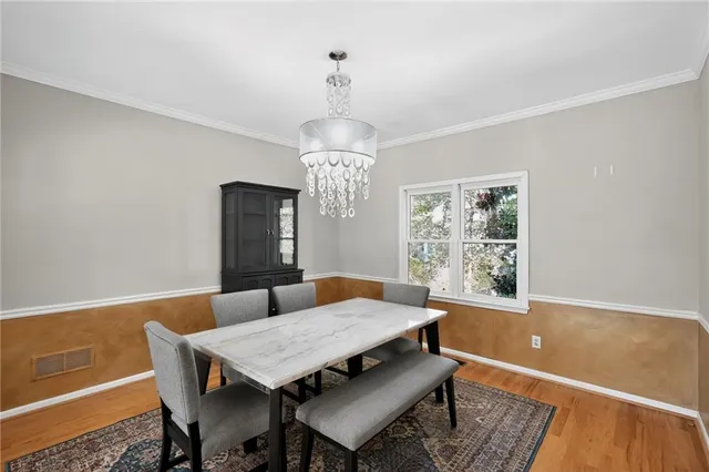 a room with furniture and a wooden floor