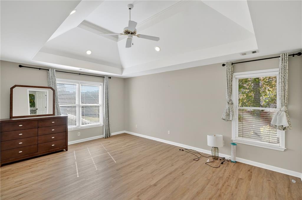 10950 Regal Forest Drive Suwanee, GA 30024 - Photo 34 of 52 wooden floor and windows in a room