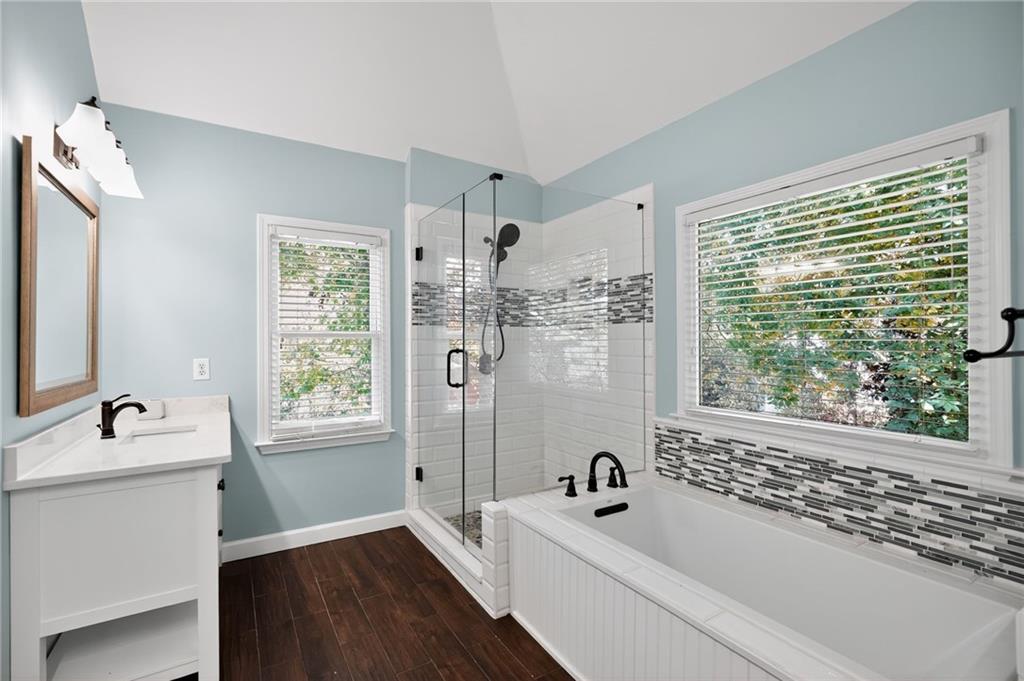 10950 Regal Forest Drive Suwanee, GA 30024 - Photo 38 of 52 a bathroom with a tub sink and window
