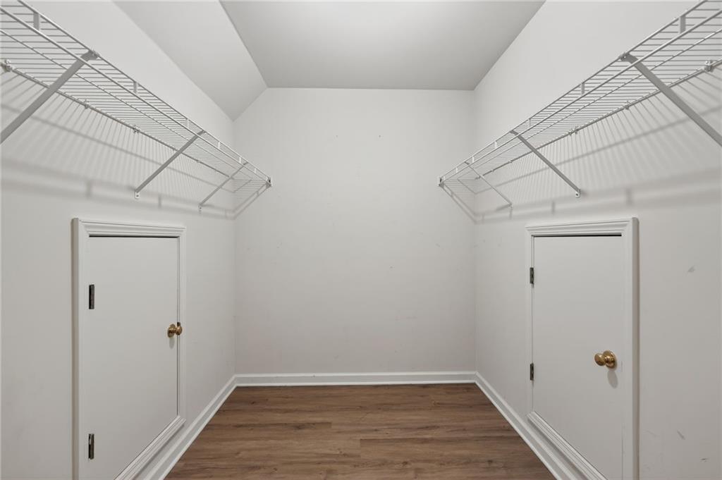 10950 Regal Forest Drive Suwanee, GA 30024 - Photo 39 of 52 a view of a storage & utility room with wooden floor
