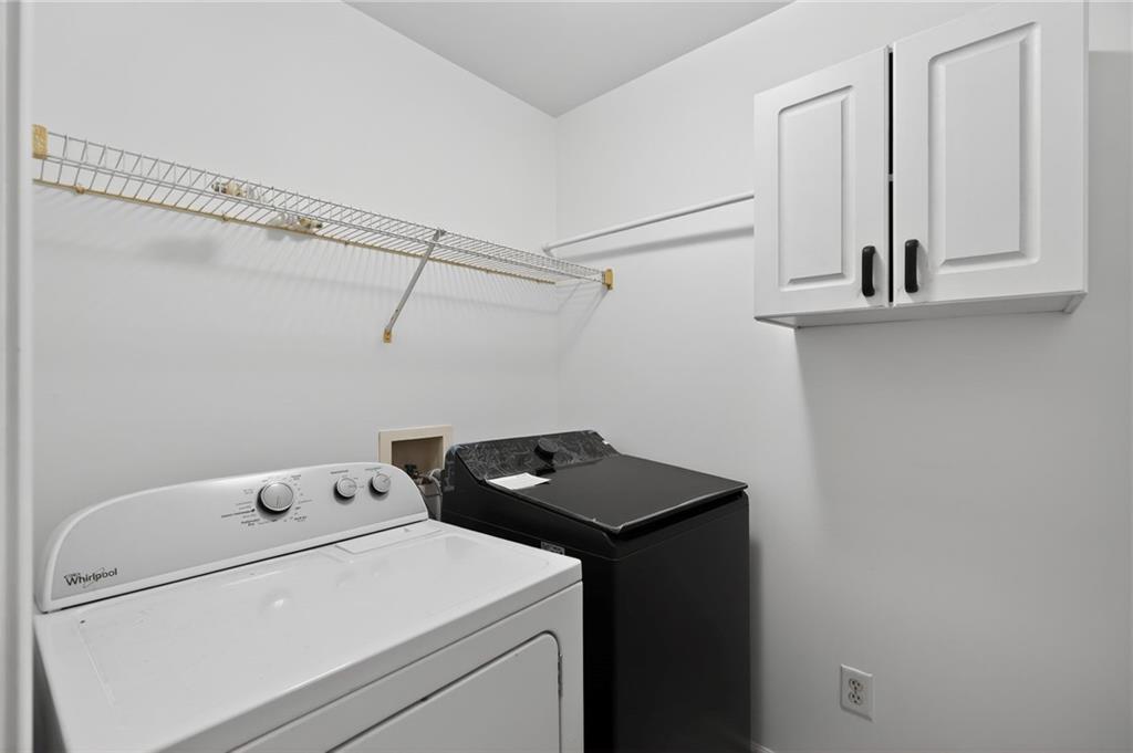 10950 Regal Forest Drive Suwanee, GA 30024 - Photo 41 of 52 a utility room with dryer and washer