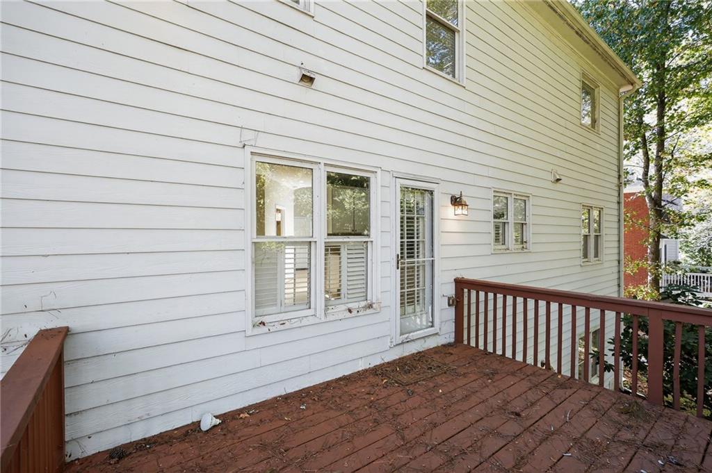 10950 Regal Forest Drive Suwanee, GA 30024 - Photo 46 of 52 a view of a house with wooden deck
