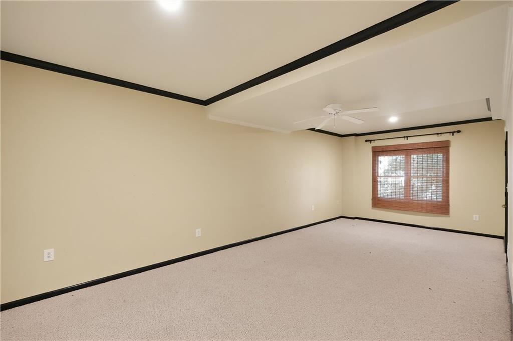 10950 Regal Forest Drive Suwanee, GA 30024 - Photo 47 of 52 a view of an empty room with a window