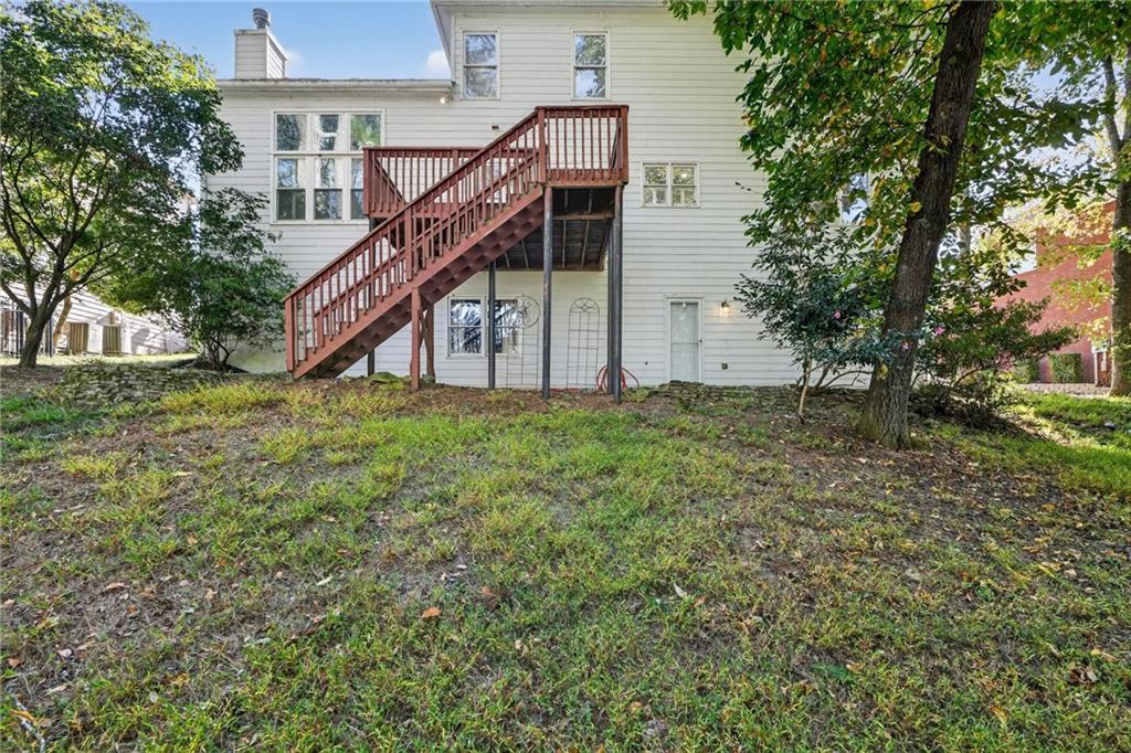10950 Regal Forest Drive Suwanee, GA 30024 - Photo 51 of 52 a view of a house with a yard