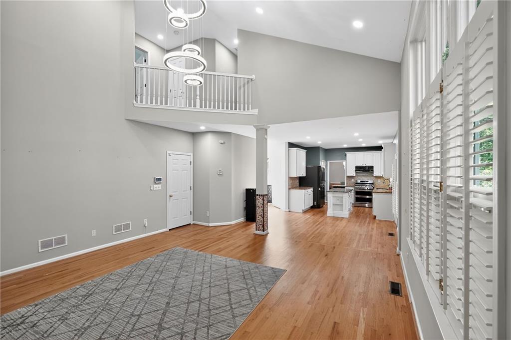10950 Regal Forest Drive Suwanee, GA 30024 - Photo 10 of 52 a view of a livingroom with wooden floor