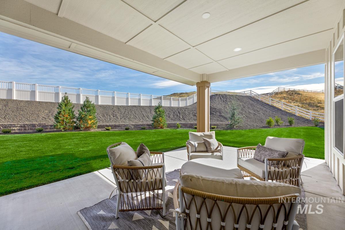 13544 North Ruffed Grouse Way Boise, ID 83714 - Photo 27 of 44 Fenced backyard with outdoor lounge area and a patio area
