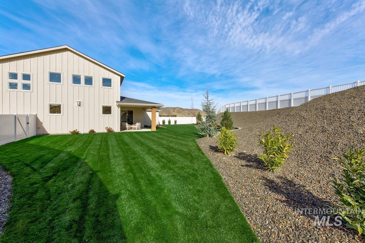 13544 North Ruffed Grouse Way Boise, ID 83714 - Photo 28 of 44 Fenced backyard with a patio area