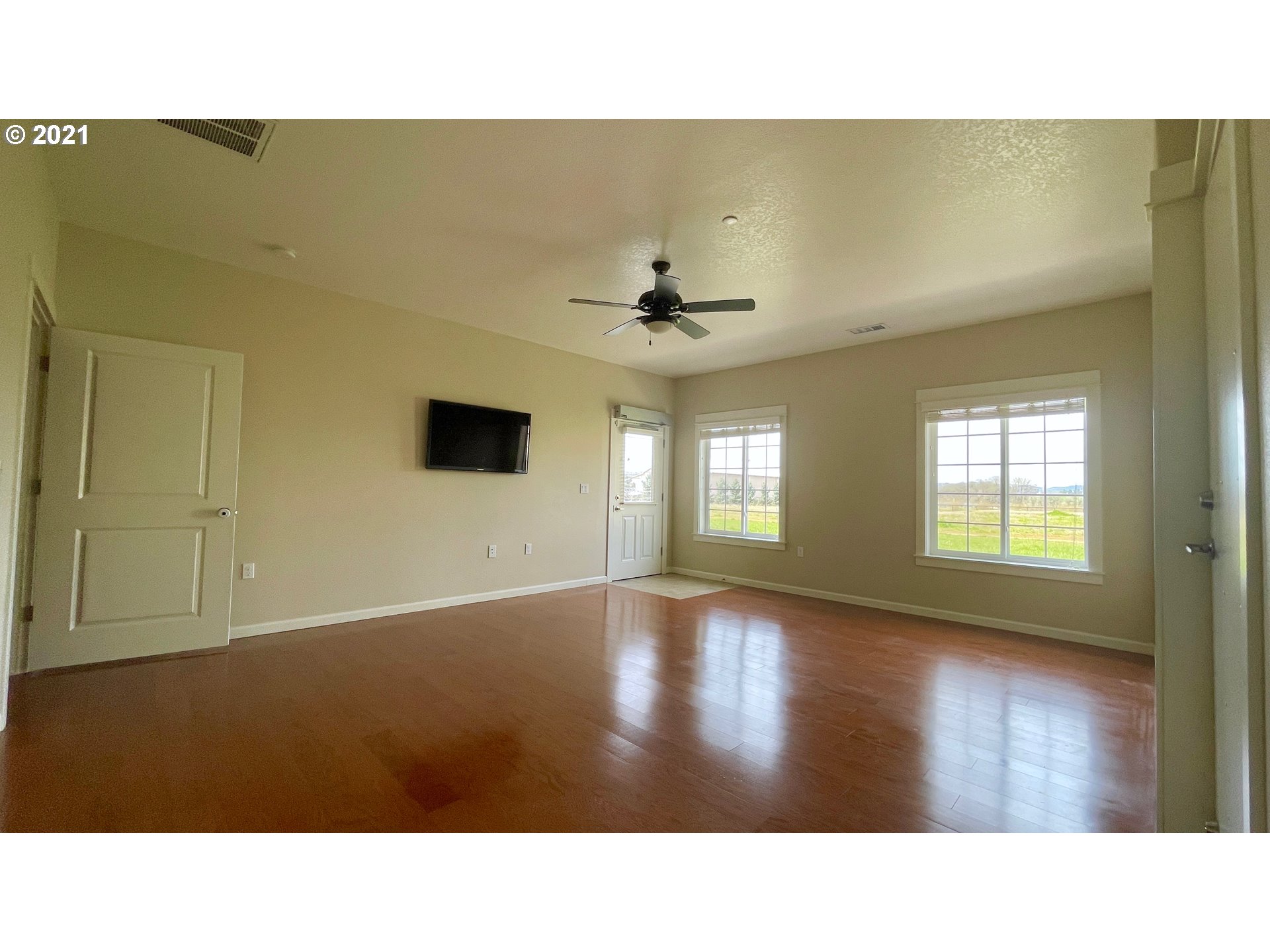 8765 Southwest River Road Hillsboro, OR 97123 - Photo 12 of 31 a open hall with a hardwood floor