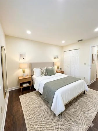 a bedroom with a bed and a couch