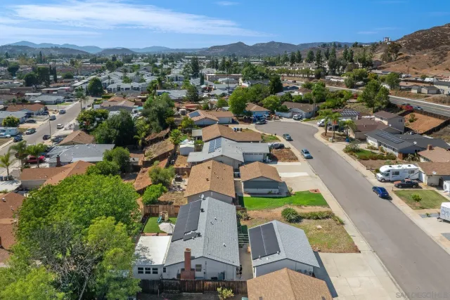 an aerial view of residential houses with outdoor space