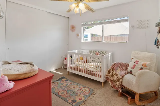 a bedroom with furniture and a window