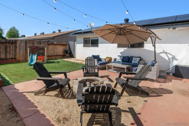 a patio with table and chairs