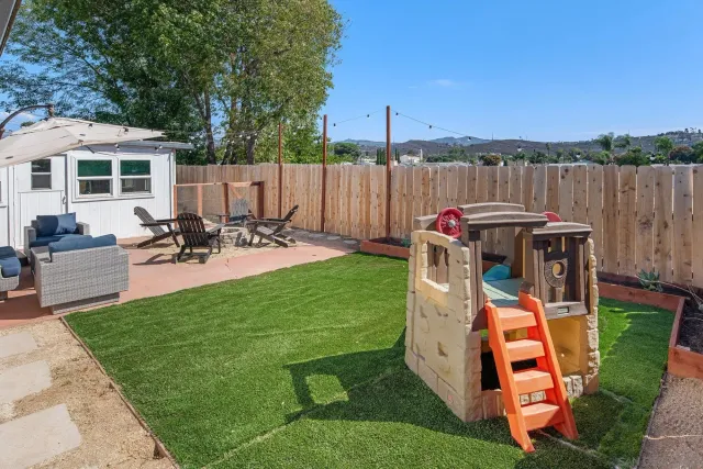swimming pool view with a seating space