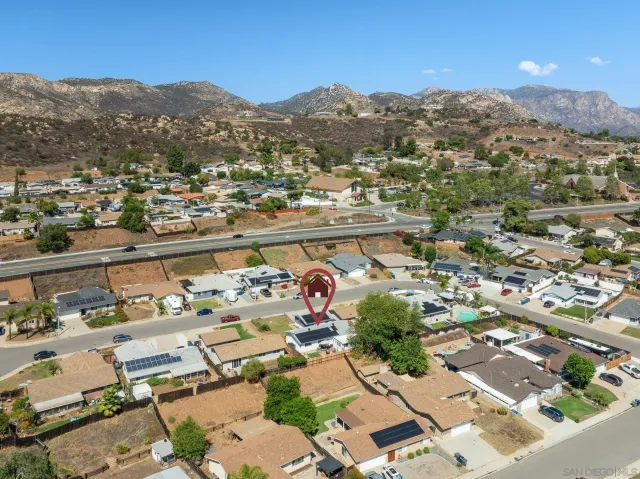 an aerial view of residential houses and city view