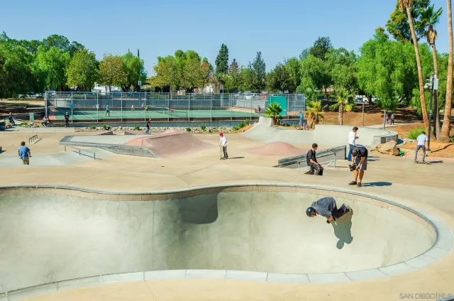 a view of a swimming pool with an outdoor space and seating area