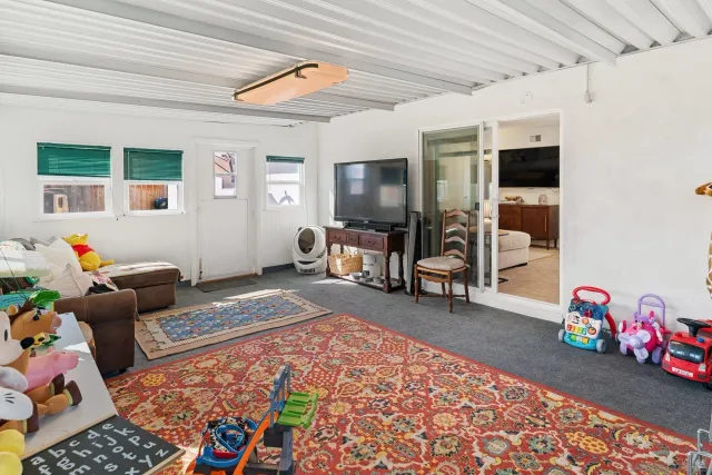 a bedroom with furniture and a window