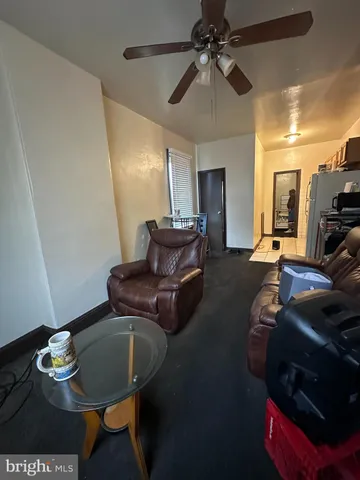 a kitchen with a refrigerator a stove a washer and dryer