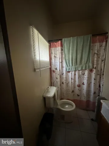 a bed room with furniture and a flat screen tv