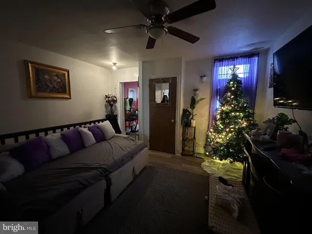 a bedroom with a bed gym equipment and a window