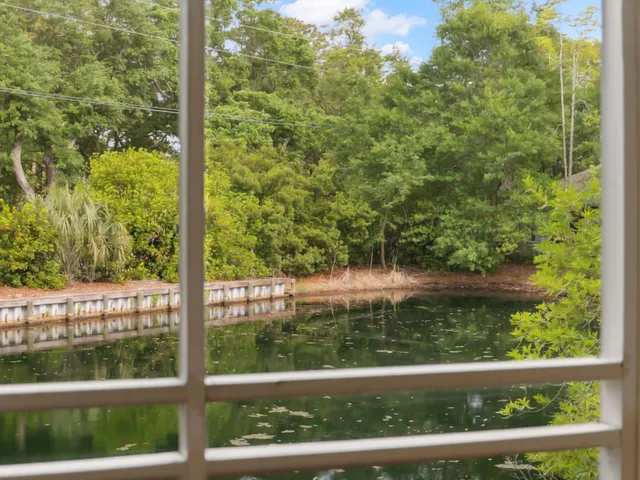 a bedroom with a bed and a mirror