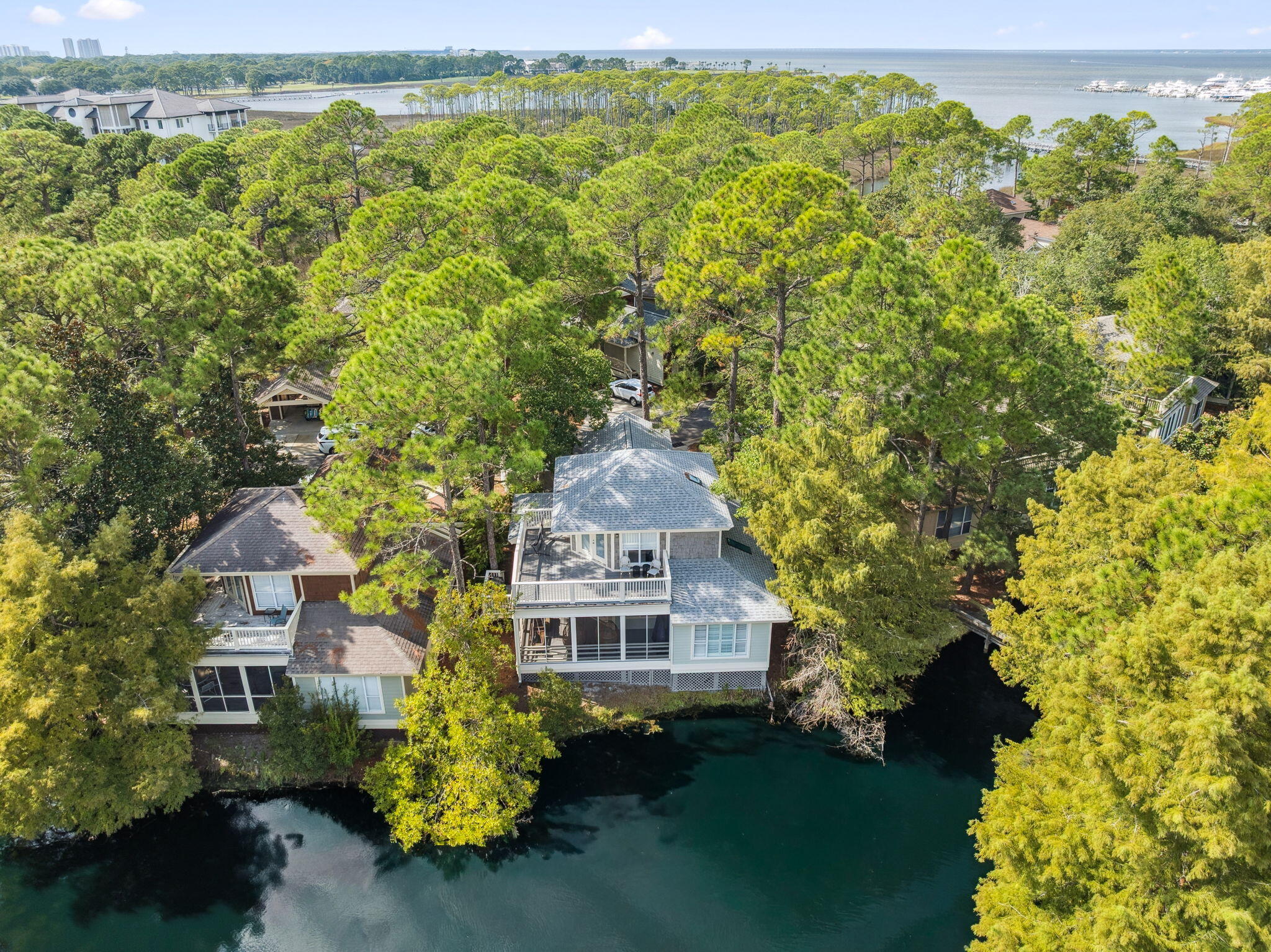 8855 Baypine Drive Miramar Beach, FL 32550 - Photo 2 of 49 a front view of a house with a yard