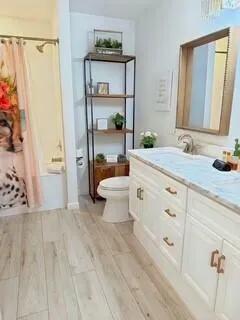 a spacious bedroom with a bed and a window