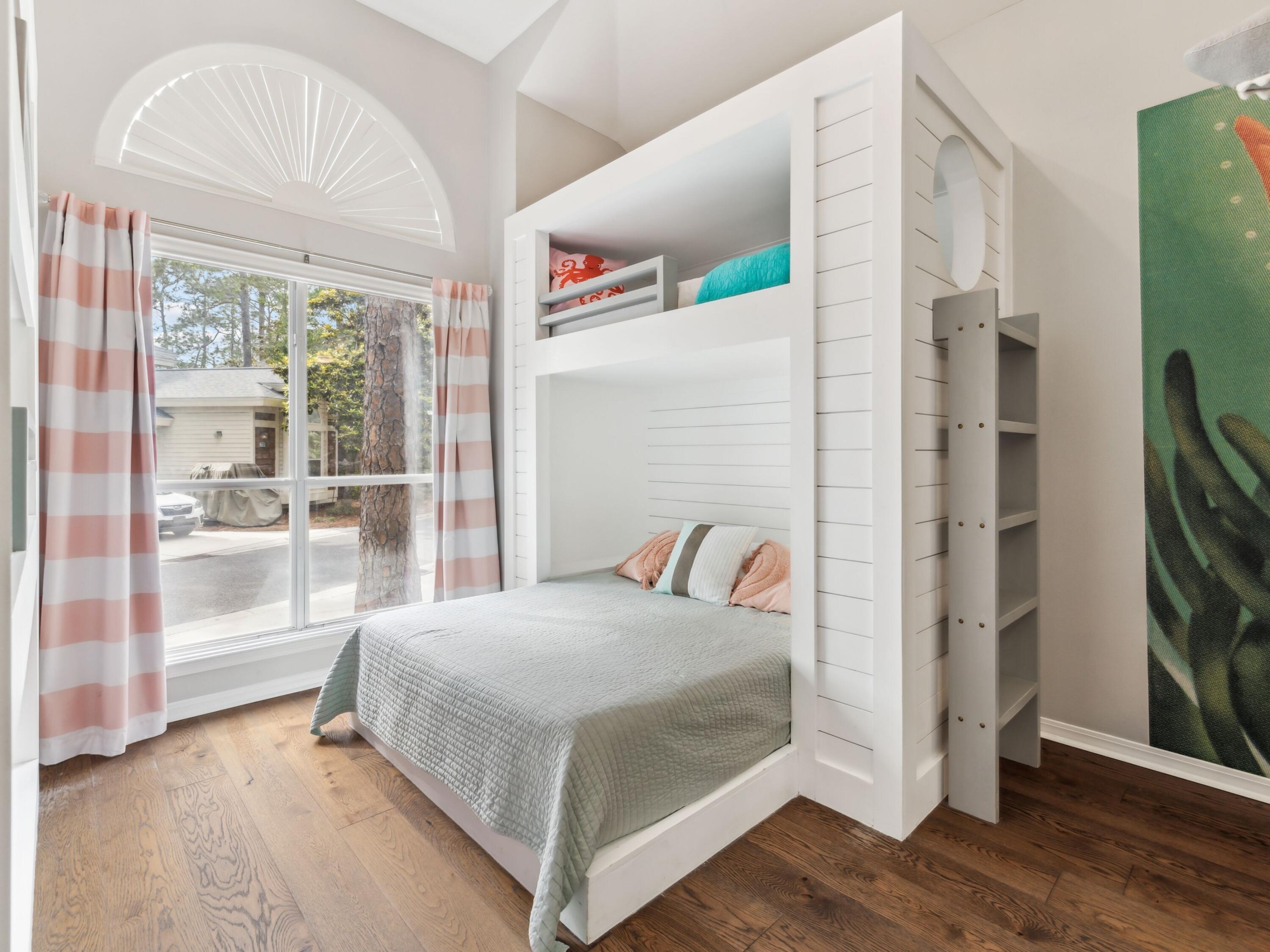 8855 Baypine Drive Miramar Beach, FL 32550 - Photo 25 of 49 a bedroom with a bed and a mirror