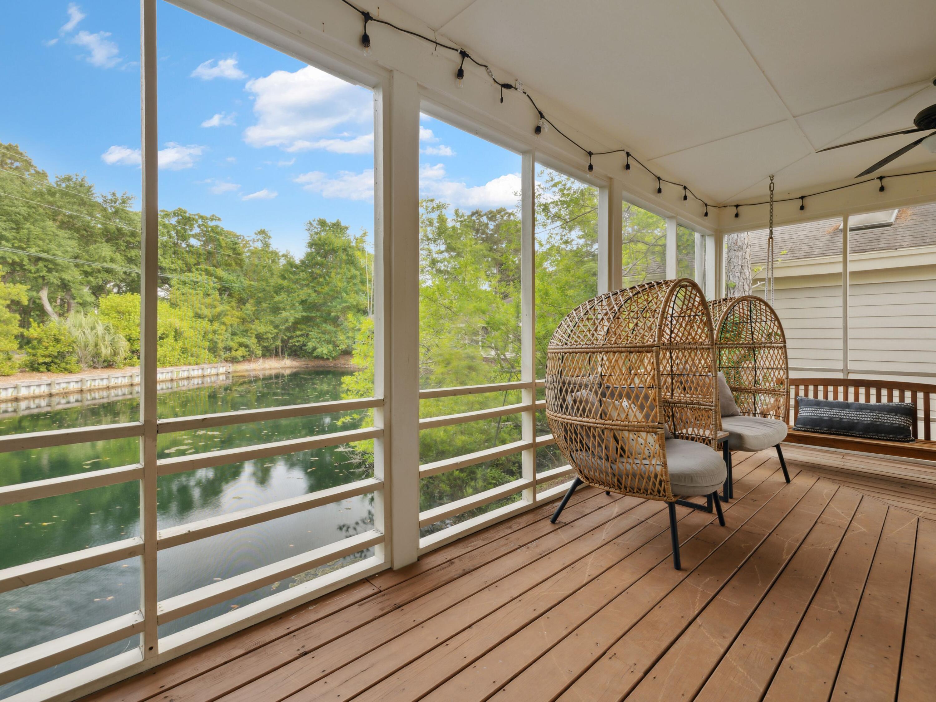 8855 Baypine Drive Miramar Beach, FL 32550 - Photo 29 of 49 a view of a balcony with wooden floor next to a yard