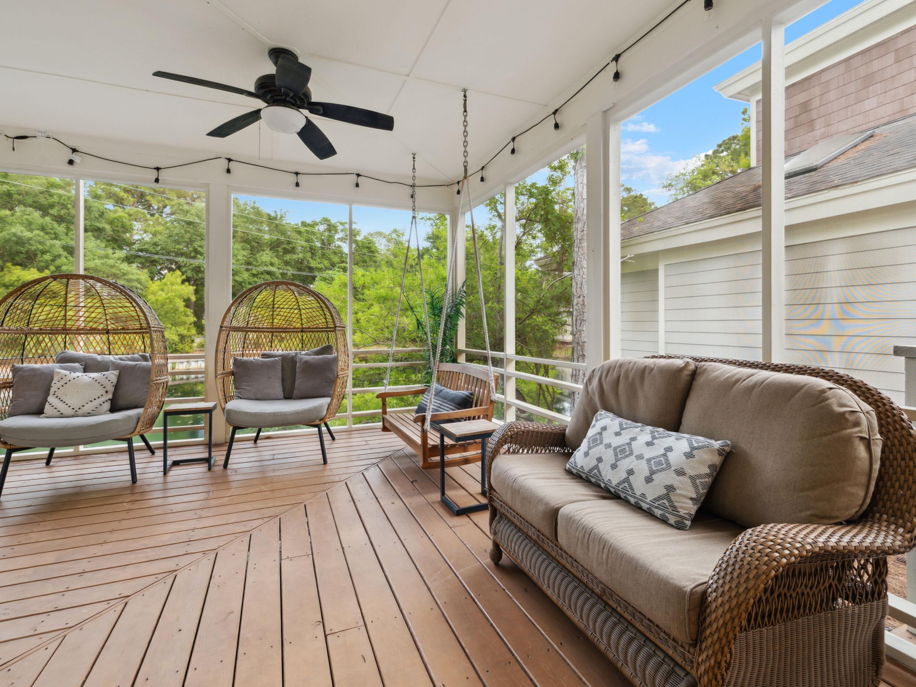 8855 Baypine Drive Miramar Beach, FL 32550 - Photo 31 of 49 a living room with furniture and a floor to ceiling window