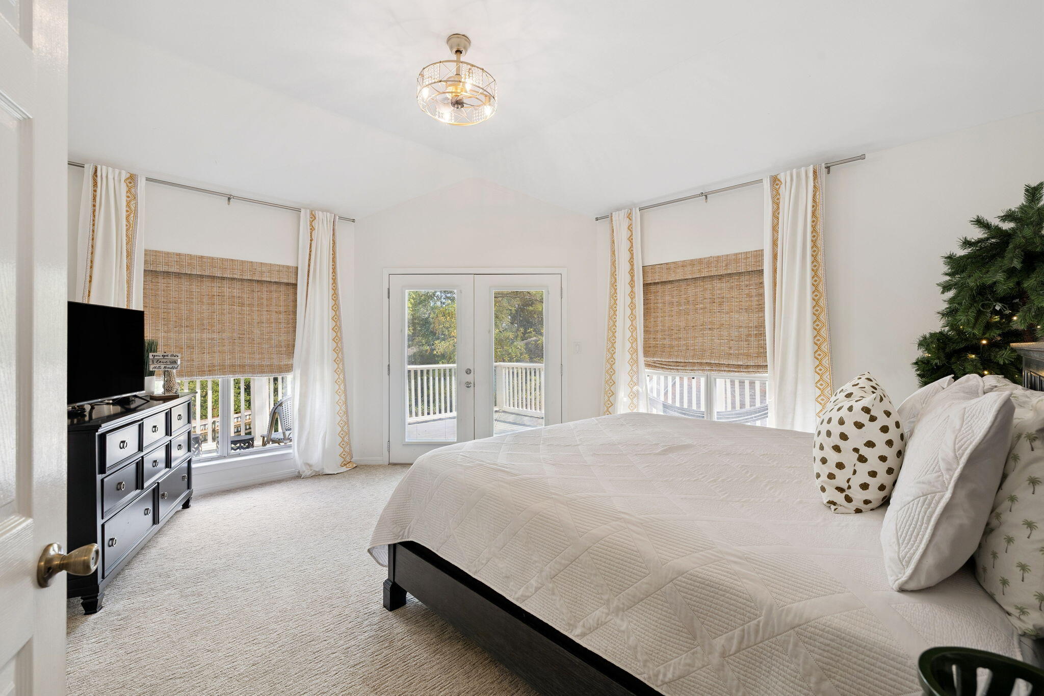 8855 Baypine Drive Miramar Beach, FL 32550 - Photo 34 of 49 a spacious bedroom with a bed and a flat screen tv