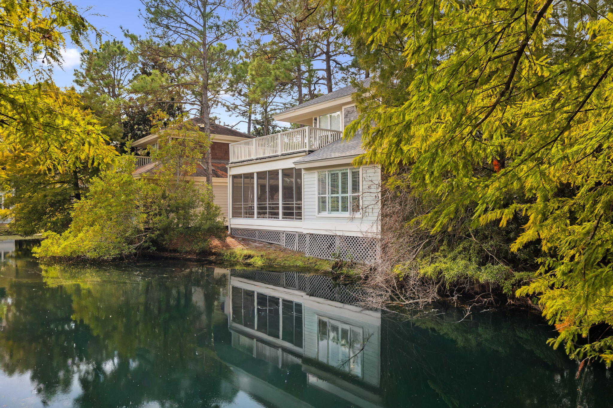 8855 Baypine Drive Miramar Beach, FL 32550 - Photo 6 of 49 a view of a house with a lake view