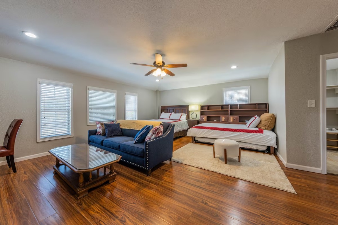 1212 North Main Street Elgin, TX 78621 - Photo 16 of 31 Bedroom featuring wood finished floors, recessed lighting, and a ceiling fan