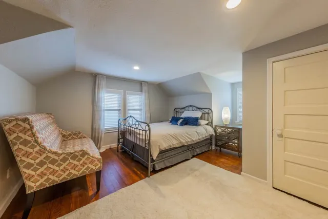 a bedroom with two beds and painted walls
