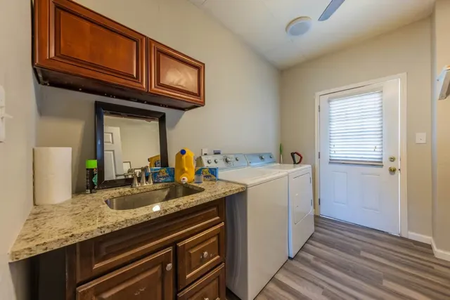 a kitchen with a sink and cabinets