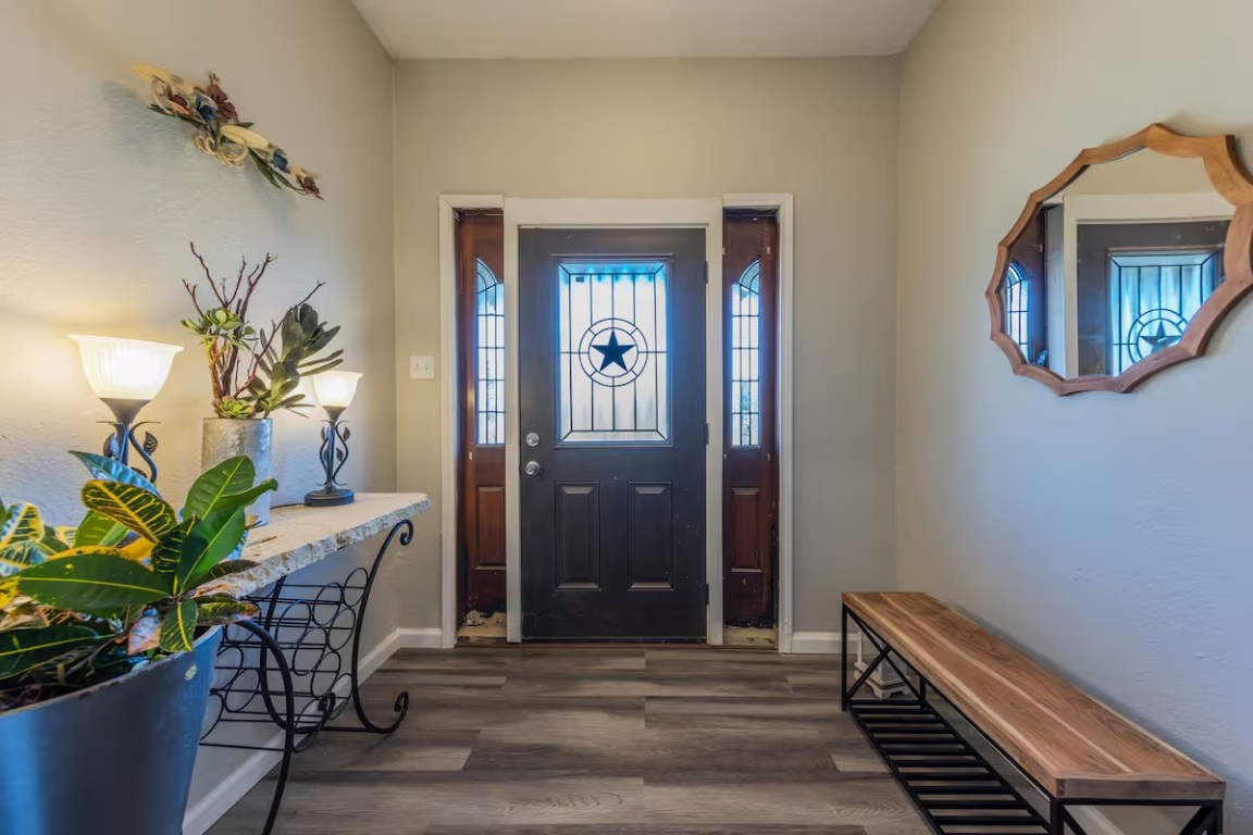 1212 North Main Street Elgin, TX 78621 - Photo 27 of 31 Entrance foyer with dark wood-type flooring and baseboards