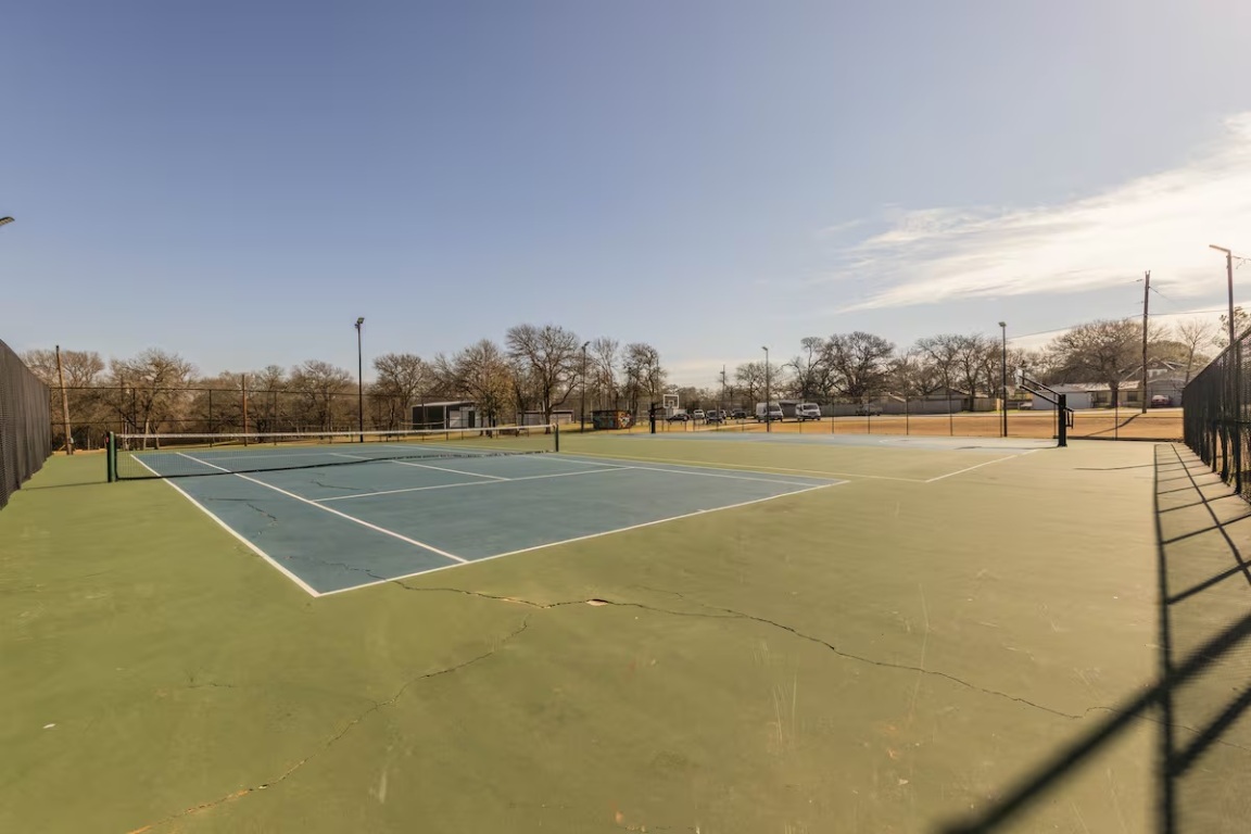 1212 North Main Street Elgin, TX 78621 - Photo 30 of 31 View of tennis court with community basketball court
