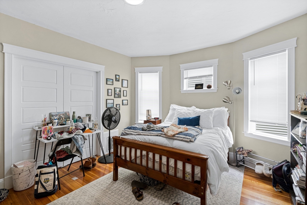 79 Saxton Street, Unit 3 Boston, MA 02125 - Photo 5 of 12 a bedroom with a bed and a tv