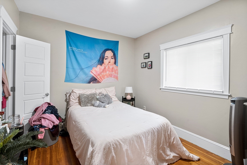 79 Saxton Street, Unit 3 Boston, MA 02125 - Photo 7 of 12 a bedroom with a bed and a window