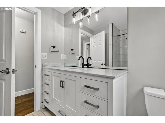 a bathroom with a sink double vanity and a mirror