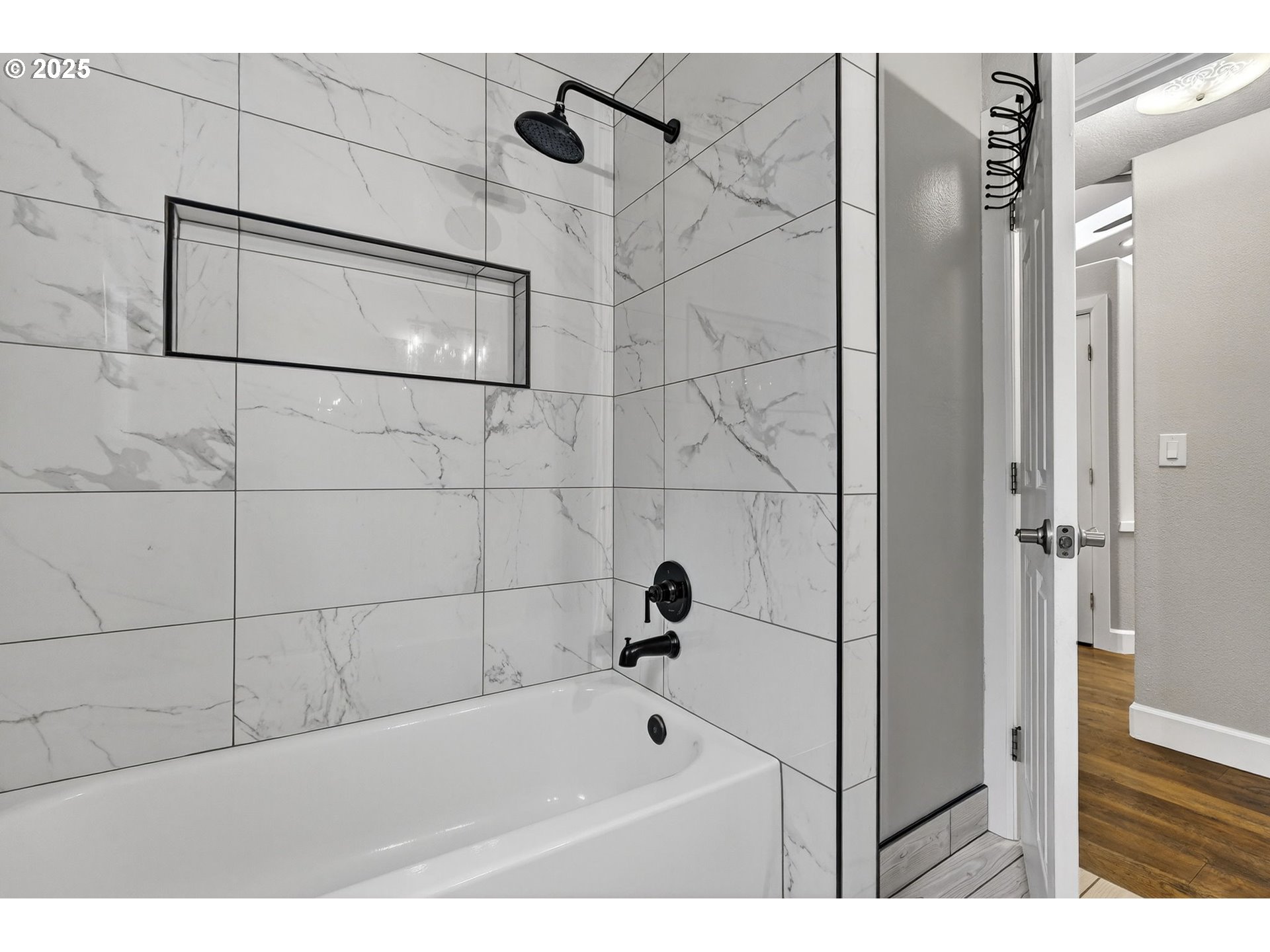 5118 Northeast Jarrett Street Portland, OR 97218 - Photo 20 of 46 a bathroom with a bathtub and shower