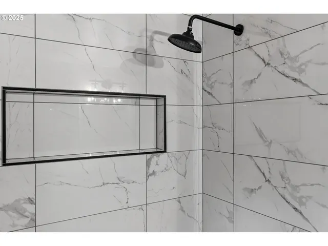 a view of an empty room and wooden floor