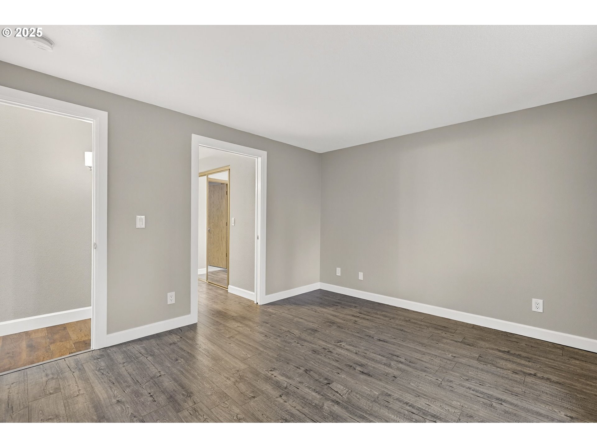 5118 Northeast Jarrett Street Portland, OR 97218 - Photo 22 of 46 a view of an empty room and wooden floor