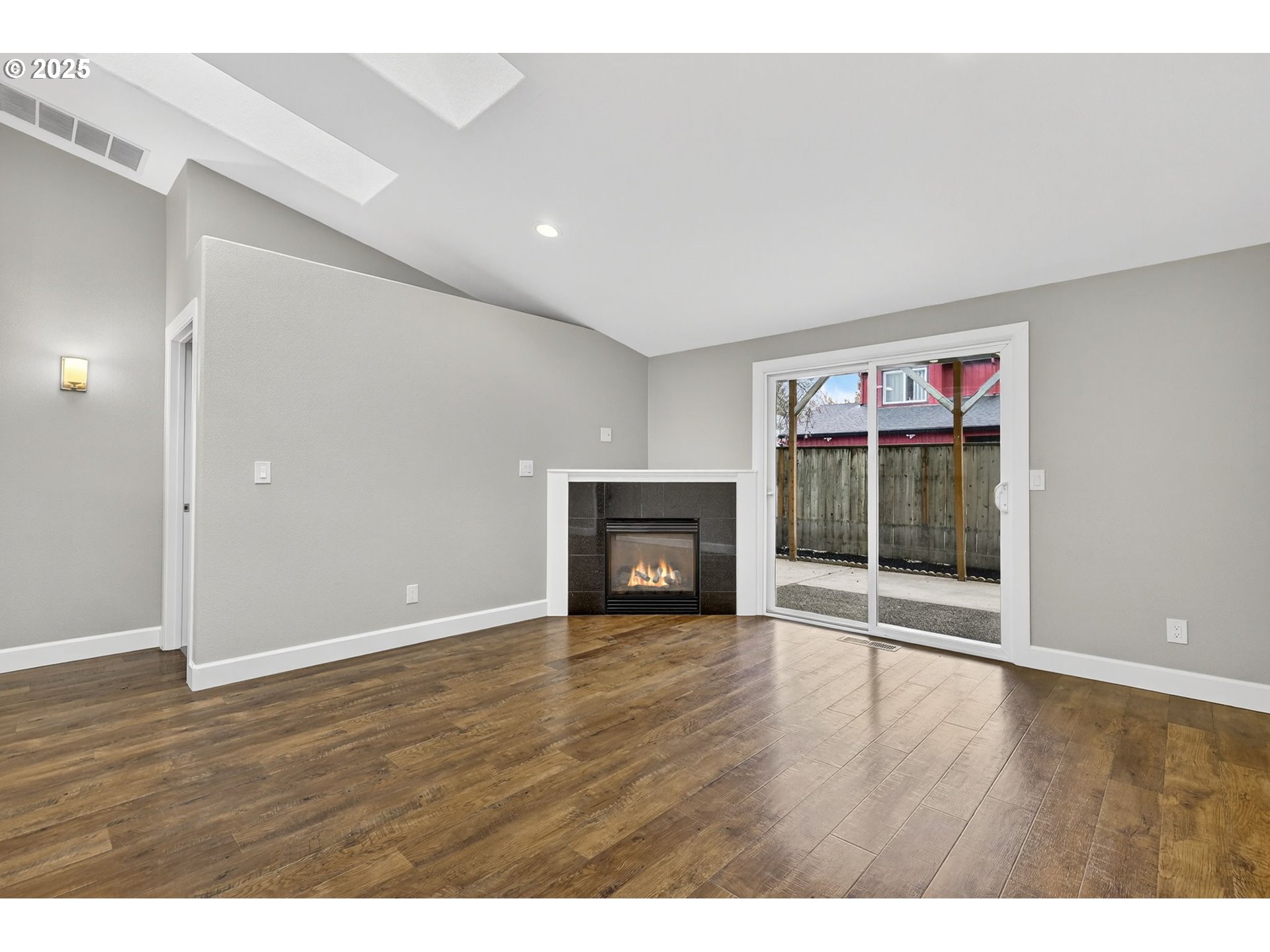 5118 Northeast Jarrett Street Portland, OR 97218 - Photo 4 of 46 a view of a room with wooden floor and window