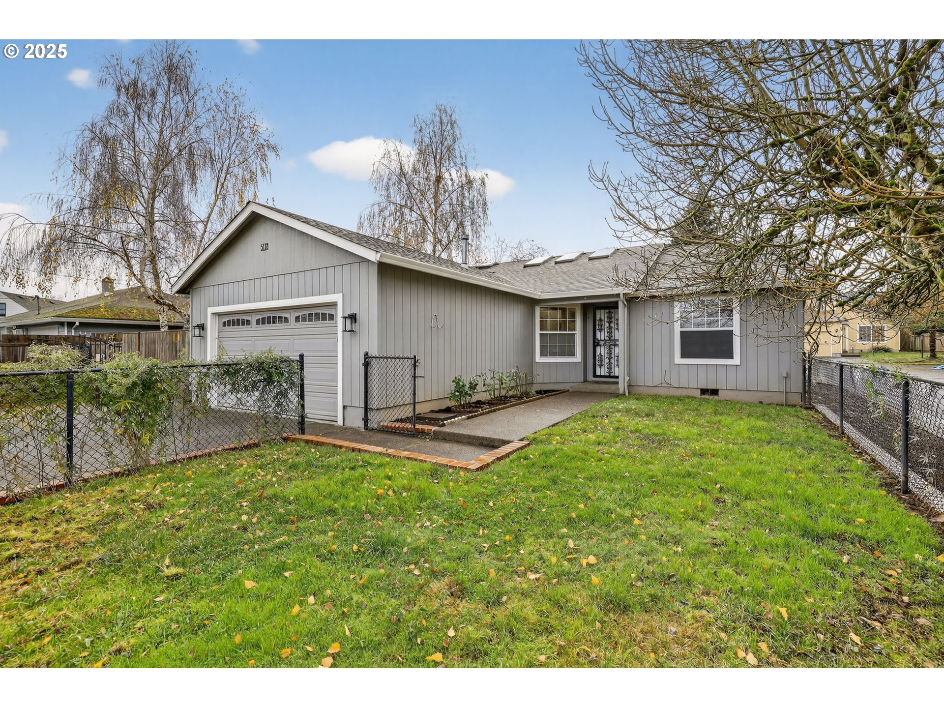 5118 Northeast Jarrett Street Portland, OR 97218 - Photo 45 of 46 a view of a house with a yard and sitting area