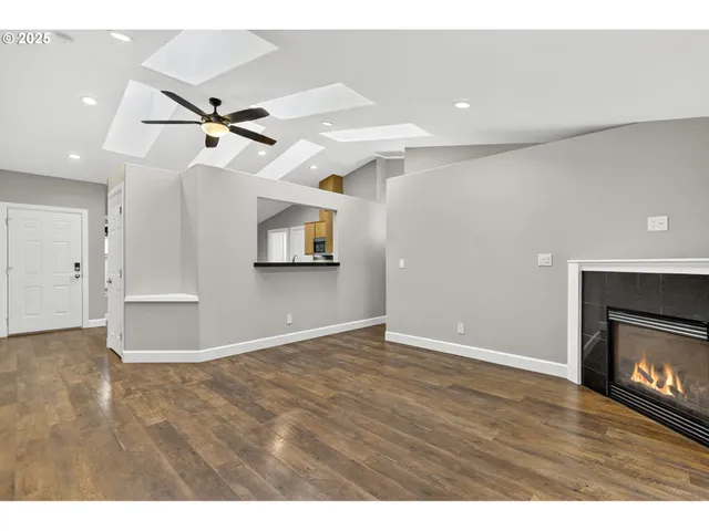 a view of an empty room and fire place