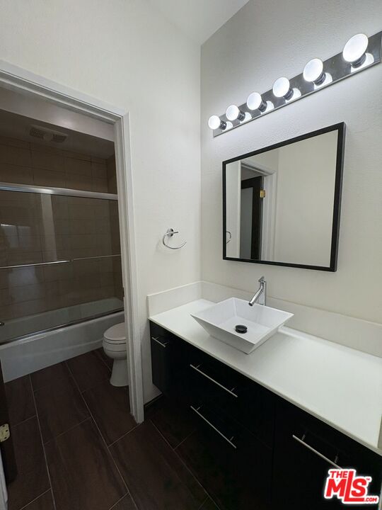 8162 Manitoba Street, Unit 111 Playa del Rey, CA 90293 - Photo 13 of 17 a bathroom with a sink a light fixture and a mirror